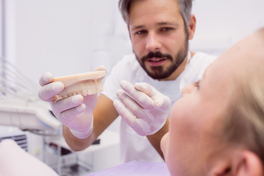 dentist explaining about temporary dentures