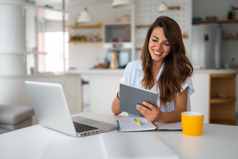 Female,Business,Person,Using,Digital,Tablet,And,Laptop,Or,Remote canadian dental plan for seniors