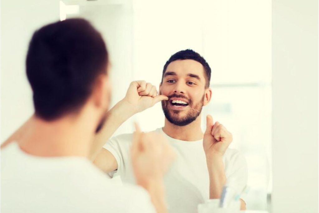 flossing-teeth-as-part-of-a-healthy-daily-dental-care-routine